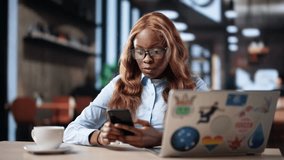 Graphic Designer Woman Using Mobile Phone At Coffee Shop - Powered by Shutterstock - Get 15% off with code: PIKWIZARD15