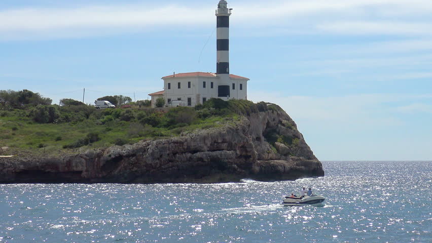 Light house of Felanitx viewed fron the natural Cave of Foradada, in the West side of Mallorca Island, Spain.