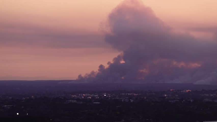 Backburning Fire Control In Distance In The Greater Sydney Region of New South Wales, Australia. Wide Shot