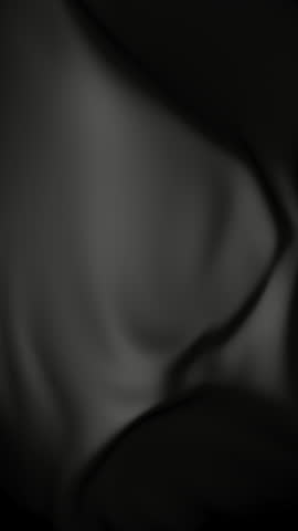Black satin fabric softly blowing in the wind seamless looping backdrop animation. Vertical video.