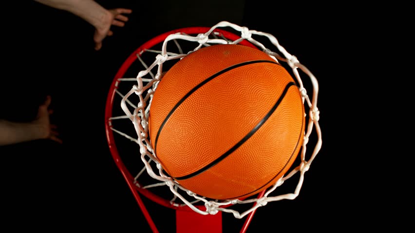 Super Slow Motion of Basketball Player Throwing the Ball and Hitting the Basket. Filmed on High Speed Cinema Camera, 1000fps.