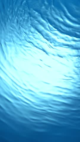 Super Slow Motion of Blue Water Waves in Detail. Filmed on High Speed Cinema Camera, 1000 fps. Top Shot Composition, Vertical Aspect Ratio.