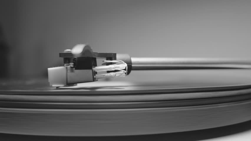 a record player spinning in black and white  - Powered by Shutterstock - Get 15% off with code: PIKWIZARD15