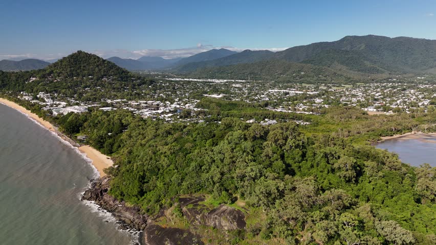 Kewarra Beach, Taylor Point, and Trinity Beach, Cairns, Queensland, Australia: 4K Aerial Drone Footage Featuring Coastal Waters of Great Barrier Reef, Rocky Headland, Palm Fringed Beach, and Ocean
