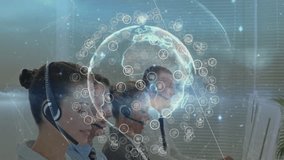 Call center agents watching screens starting globe overlay pulsing nodes enabling global network. Technicians, communication, digital, technology, collaboration, professional, modern - Powered by Shutterstock - Get 15% off with code: PIKWIZARD15