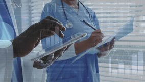 Doctor tapping tablet and nurse noting in medical office, showing pie charts, graphs reviewing data. Medical, analytics, technology, collaboration, healthcare, data visualization, clinical - Powered by Shutterstock - Get 15% off with code: PIKWIZARD15