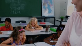 When class starts teacher observing students writing as user-icon network visualizing education. Collaboration, learning, engagement, education, digital, classroom, teamwork - Powered by Shutterstock - Get 15% off with code: PIKWIZARD15