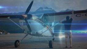 Pilot placing hands on wing strut and activating aviation network overlay for aircraft inspection. Aerospace, innovation, technology, connectivity, aviation, engineering, scenery - Powered by Shutterstock - Get 15% off with code: PIKWIZARD15