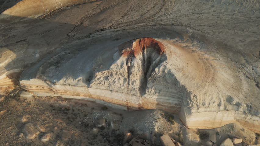 Eroded round crater with sharp vertical walls filmed from the air. Aktumsuk reveals the geology of Uzbekistan
