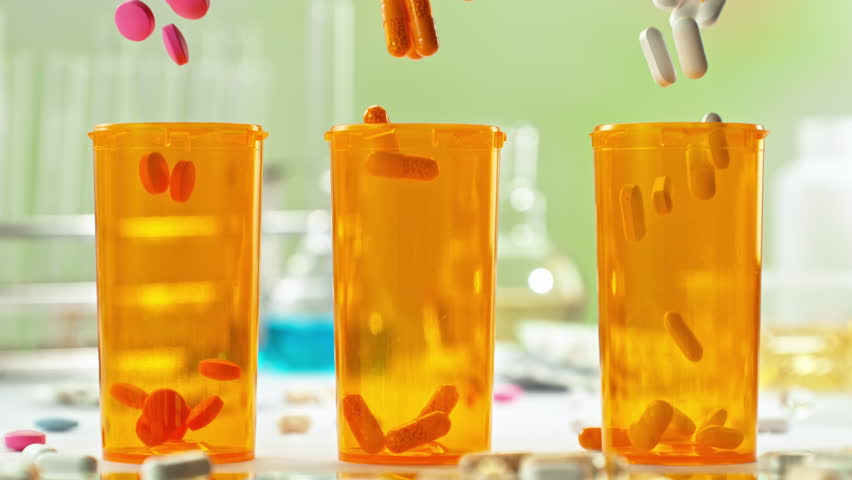Super Slow Motion of Various Pills Falling into Medicine Cans at 1000fps.