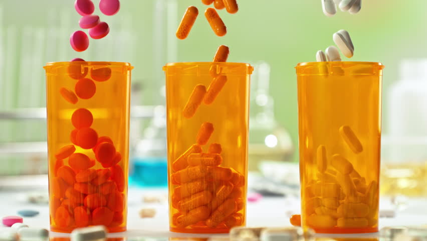 Super Slow Motion of Various Pills Falling into Medicine Cans at 1000fps.
