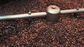 Freshly Roasted Coffee Beans Cooling in Tray with Spinning Arms – 4K Footage High-quality 4K video showing freshly roasted coffee beans being cooled in a circular cooling tray.	 - Powered by Shutterstock - Get 15% off with code: PIKWIZARD15