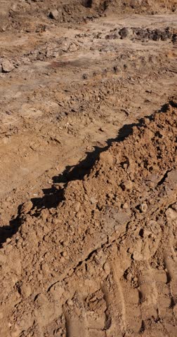 road construction work during the excavation of a pit for laying different layers of materials before asphalting, a deep hole in the ground on the site of which a highway was started