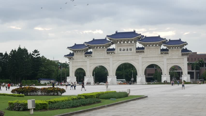 landscape view of giant gate at Chiang Kai Shek Memorial hall in Taipei City, Taiwan among sunny daytime. beautiful architecture building famous tourist landmark national monument of Taiwan