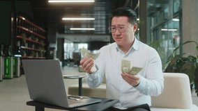 Depressed Asian businessman feeling worried about financial problem. Stressed man in shirt looking frustrated thinking of money debt, bad day, budget loss, bankruptcy sitting in modern office lobby. - Powered by Shutterstock - Get 15% off with code: PIKWIZARD15