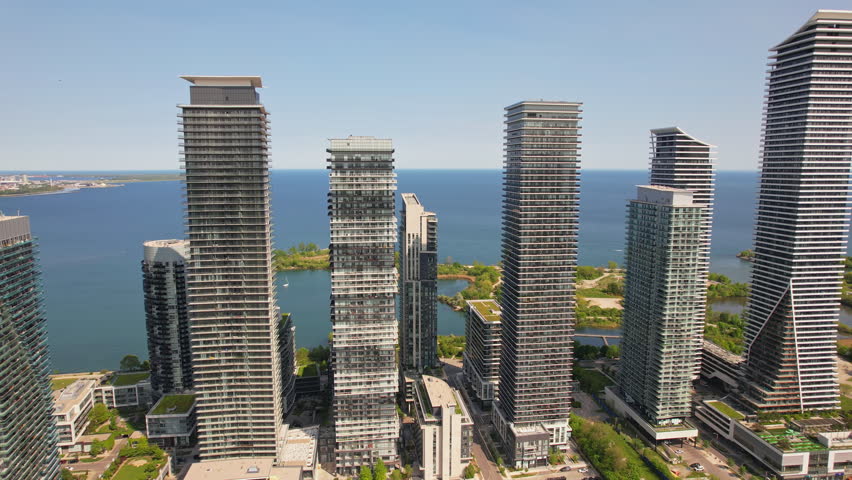 Aerial view of Humber Bay Shores, Etobicoke near Toronto area is chic waterfront gem. Epic cityscape condos buildings, vibrant green park trails near lakefront scenic escapes and modern living. Mimico