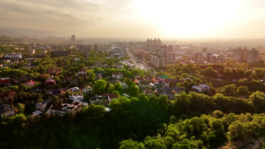 Aerial view panorama of houses and mountains in Almaty