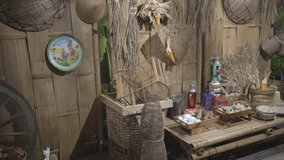 traditional Indonesian kitchen with traditional baskets, plates and decorative items on a wooden table with a bamboo background - Powered by Shutterstock - Get 15% off with code: PIKWIZARD15