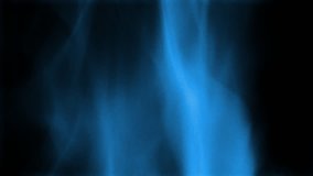 Close up of blue flames over black