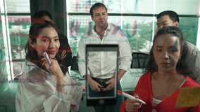 Professional business team brainstorming marketing idea by using sticky notes to share creative idea at glass wall. Group of diverse business team discuss about strategy. Closeup. Manipulator. - Powered by Shutterstock - Get 15% off with code: PIKWIZARD15