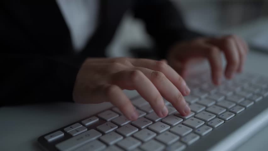 Hands Typing on Keyboard with Import Tariffs Graphic Overlay Highlighting Economic Impact of Tariffs in Digital Commerce and International Trade. Consignment.
