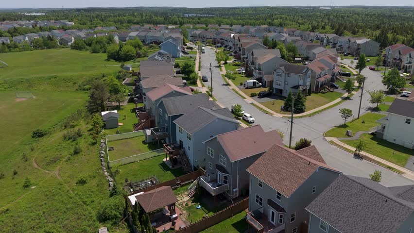 Aerial View Of Cozy Residential Area With Houses, Streets, Trees, And Warm Golden Light Shining On Rooftops In Halifax, Nova Scotia, Canada.