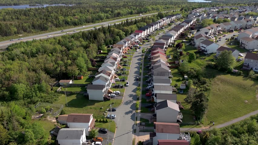 Aerial View Offers A Look At Clean And Safe Suburban Life In Canada, With Lush Foliage And Carefully Placed Homes In Halifax. Over Halifax Suburbs With Trees And Rooftops. High quality 4k footage