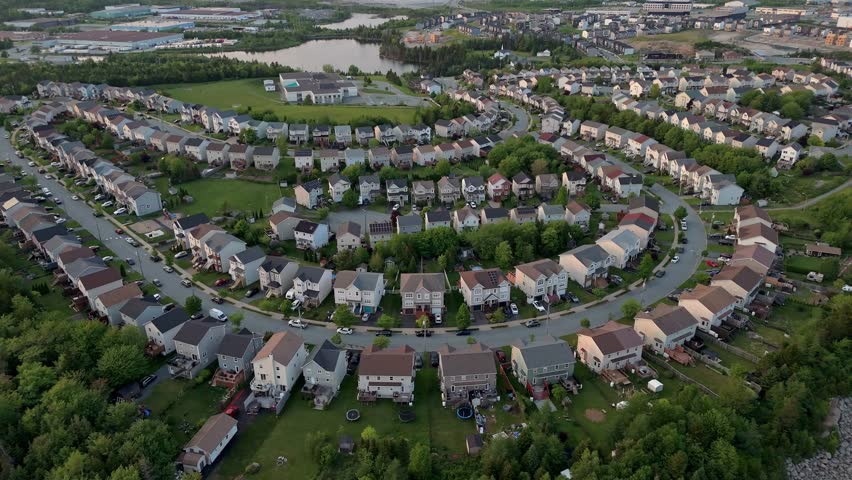 Aerial View Highlights A Well-Organized Neighborhood With Colorful Roofs, Curved Roads, And Lush Green Spaces In Halifax, Nova Scotia, Canada.