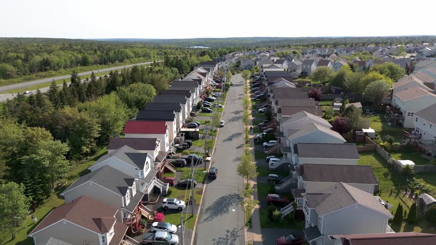 Aerial View Focuses On Bright Roofs, Fences, Lawns, And A Layout That Reflects A Peaceful Community Lifestyle In Nova Scotia. Family Homes And Streets In Halifax Nova Scotia. High quality 4k footage