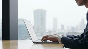 Male business person using laptop computer in urban office building - Powered by Shutterstock - Get 15% off with code: PIKWIZARD15