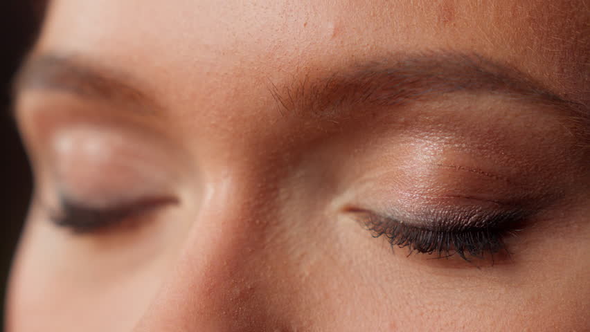 Cropped view macro extreme close up female blue eyes woman girl businesswoman business details Caucasian eyeball iris eye open eyesight gaze vision blink eyelashes skin care medical surgery health