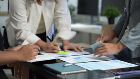 Business team using a calculator to calculate the numbers of statistic business profits growth rate on documents graph data, desk in the office. - Powered by Shutterstock - Get 15% off with code: PIKWIZARD15