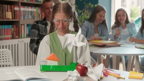 Upset crying little girl child kid schoolgirl suffering social pressure bullying in school teen pupil in class lesson cry mocking pupils rude classmates laugh throwing papers balls problem education - Powered by Shutterstock - Get 15% off with code: PIKWIZARD15