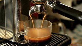 Freshly brewed espresso pouring into a glass cup with a blurred café background - Powered by Shutterstock - Get 15% off with code: PIKWIZARD15