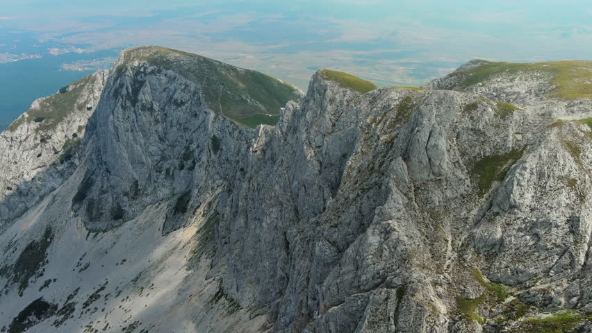 Flying in Durmitor mountains. Durmitor National park in Montenegro. Beautiful aerial mountain landscape, 4k