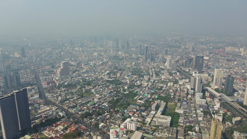 Aerial high view of skyscrapers in Bangkok city and Chao Phraya River, panorama 4k