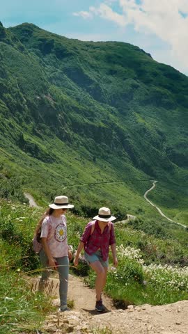 Hikers Exploring Serene Mountain Trails in Summer - Perfect for Travel and Adventure
