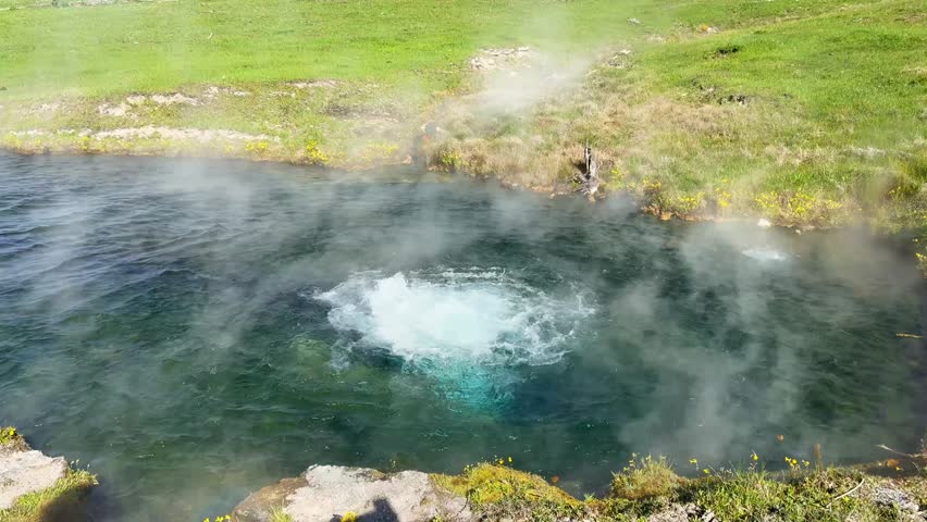 Close up view of a pool of boiling water from a bubbling hot spring at the Terrace Springs in Yellowstone National Park