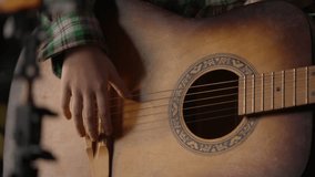 Close up Caucasian child kid guitarist little girl singer playing guitar talent schoolgirl teenager talking singing play musical instrument music song record blog vlog tutorial lesson home apartment - Powered by Shutterstock - Get 15% off with code: PIKWIZARD15