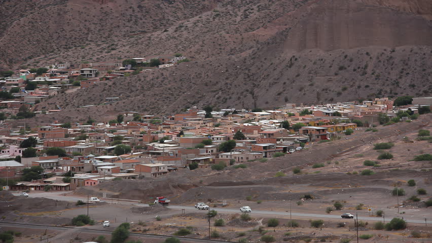 Hillside Houses and Route 40 Traffic in Tilcara, Jujuy Province, Argentina - 4K Scenic View