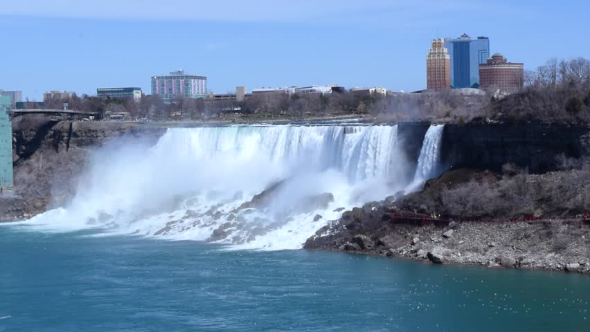 Beautiful view of American Falls and Bridal Veil Falls is waterfalls that makeup Niagara Falls. Early spring. View from Canadian side to United States side. Niagara Falls, Canada.