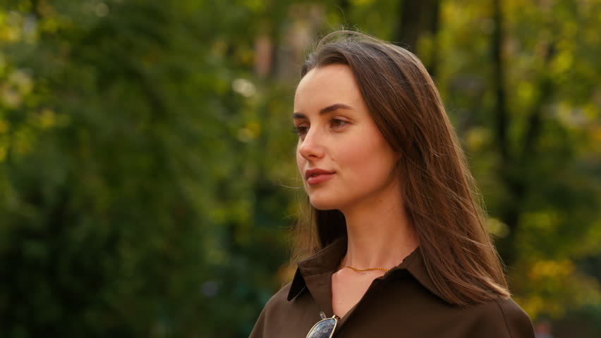 Portrait of happy smiling stylish Caucasian woman businesswoman female business girl at street autumn city looking at camera headshot carefree positive satisfied cheerful lady outdoors fashion style