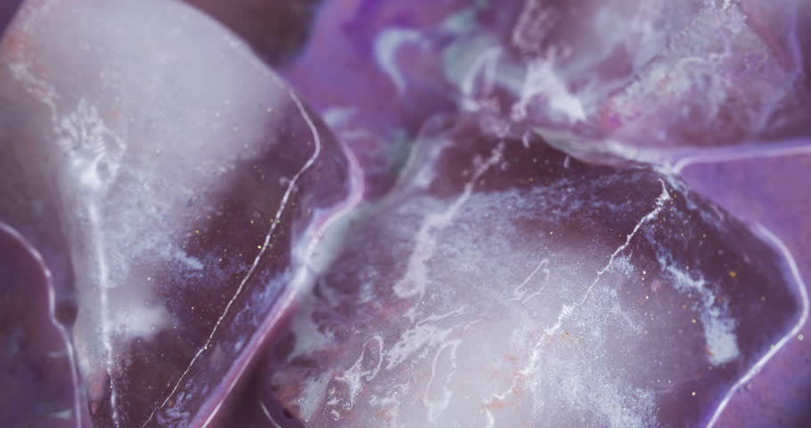 Glow liquid. Shiny ink. Defocused purple pink white color ice water frost texture wet droplets pour on abstract cold art background.
