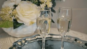 Two Champagne Flutes Celebrating with White Flowers - Powered by Shutterstock - Get 15% off with code: PIKWIZARD15