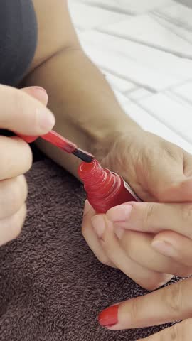 Close-up video of red nail polish being carefully applied to fingernails during a manicure. Ideal for beauty, self-care, nail art, and salon-themed visuals.
NHL YGZ
