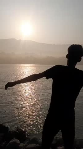 Beautiful sun rising at the bank of the river