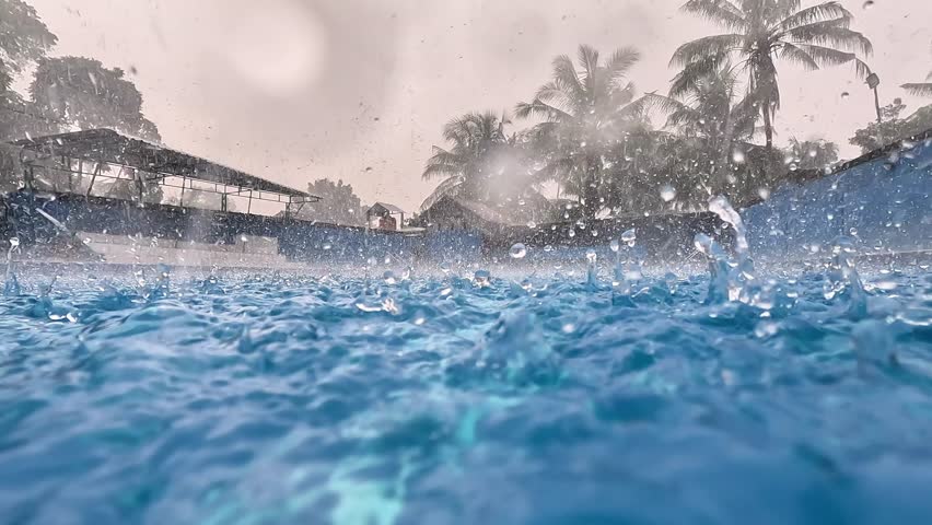 Raindrops falling in the swimming pool. Clean swimming pool.