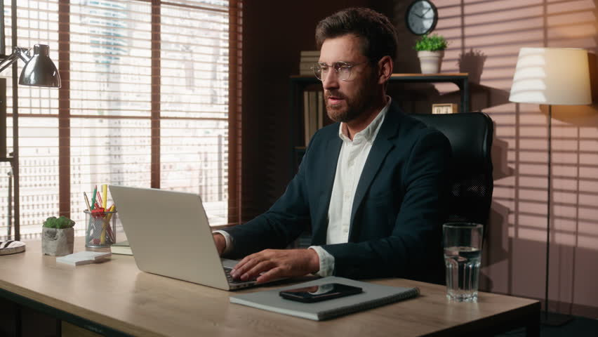 Mad furious stressed angry business work online video call yelling talking rage fury problem conference conflict arguing shout laptop nervous middle-aged Caucasian man businessman male guy in office