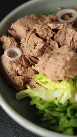 Tuna salad green leaf lettuce, canned tuna, tomato fresh delicious gourmet food background on the table rustic food top view copy space keto and paleo diet vegetarian food pescetarian diet