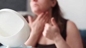 Worried young adult 30s woman looking in mirror feeling stressed about facial wrinkles problem, frustrated upset lady touching face depressed about dry sensitive aging skin care concept. - Powered by Shutterstock - Get 15% off with code: PIKWIZARD15